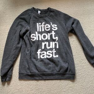 Grey sweatshirt - says life’s short, run fast.